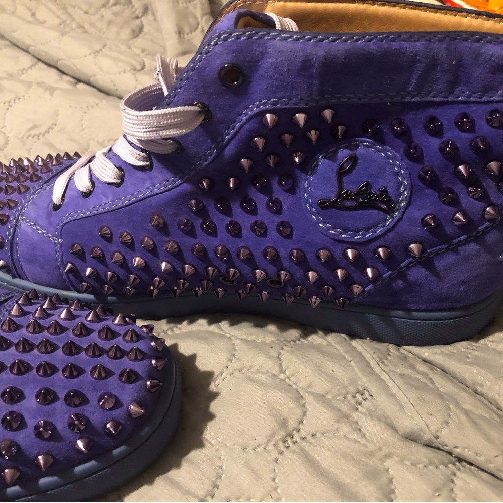 Purple christian louboutin with spikes.